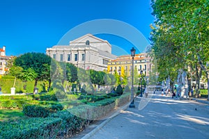 Beautiful view on the Royal Theatre (Teatro Real) from the Plaza de Oriente on the blue sky background with white clouds in Madrid photo