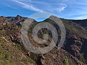 Beautiful view of the rugged mountains near road GC-605 in the center of island Gran Canaria, Spain with hiking path.