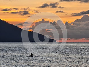 beautiful view on the Sabang sea at sunset and two fishermen are fishing there