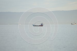 Beautiful view of the sailboat in sea in Africa. Ship with people is going fishing. Calm landscape.