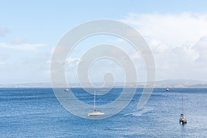 Beautiful view of sailboats sailing in the blue sea at a windy day