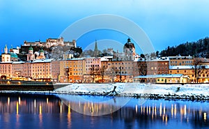 Beautiful view of Salzburg skyline with Festung Hohensalzburg and Salzach river at blue hour, Salzburger Land, Austria