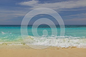 Beautiful view of sandy beach of Eagle Beach with turquoise water of Atlantic Ocean on island of Aruba.