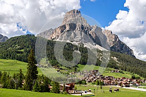 Beautiful view of the Sassongher mountain and an alpine village Corvara at the foot of the mountain