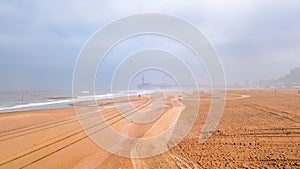 Beautiful view in Scheveningen beach ner Den Hague in morning mist, Holland, Netherlands photo