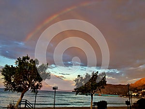 Beautiful view of the sea after rain with a rainbow in the sky