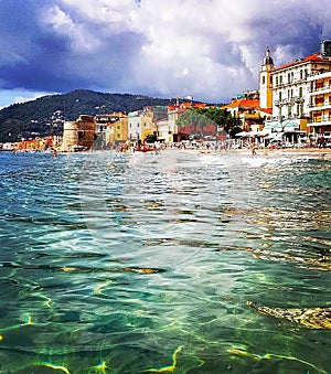 Beautiful view of the sea and the town of Alassio with colorful buildings, Liguria, Italian Riviera, region San Remo, Cote d`Azur