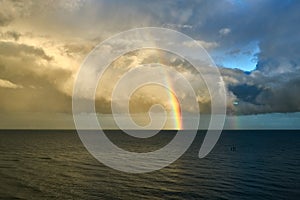 Beautiful view of the sea under a rainbow sky