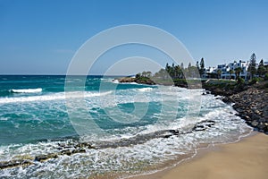 Beautiful view of the seashore of the Fig Tree Beach and the Fig Tree Bay Peninsula on the background. Protaras, Ayia Napa, Cyprus