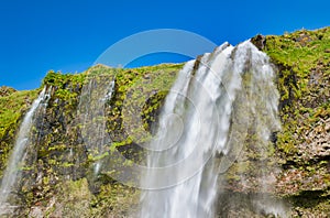 Beautiful view of Seljalandfoss Waterfalls in Iceland on a sunny summer day