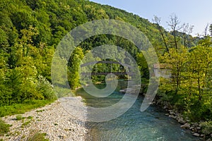 Beautiful view of the Serio river and old bridge photo