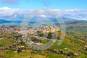 Beautiful view of Sicilian village Calascibetta taken with adjacent mountains and green landscape. The historical Arab city