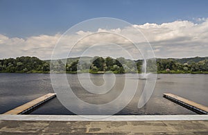 Beautiful view of Silver Lake with two wooden piers and fountain