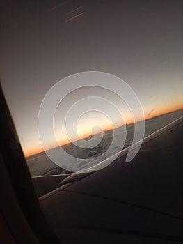 Beautiful view of sky from Aeroplan window, flying above clouds