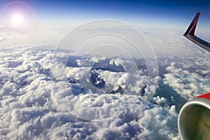 Beautiful view of the sky from the airplane window, clouds, sun