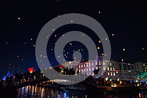 Beautiful view of sky lanterns released for fun and to make wishes in Volos, Greece