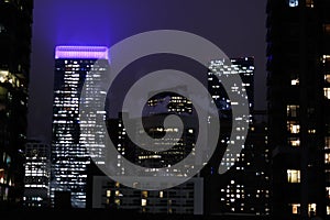 Beautiful view of skyscrapers with illuminated lights at night