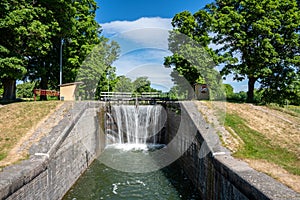 Sluice at Gota canal in Sweden with flowing water and beautiful photo