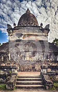 Beautiful view of stupa in Wat Visounnarath. Laos. Vertical Panorama