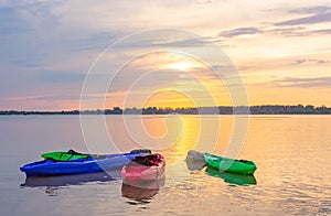 Beautiful view of sunset with canoe on the lake