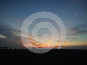 Beautiful view sunset in the rice fields on a village