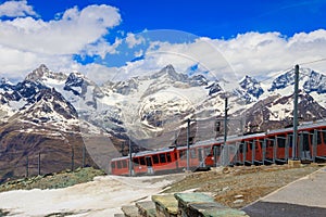 Beautiful view of the Swiss Alps with cogwheel train of Gornergrat railway, Zermatt, Switzerland