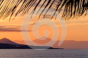 Beautiful view of Teide volcano and the island Tenerife from Las Canteras beach in Las Palmas de Gran Canaria, Spain at sunset