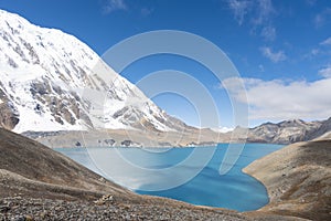 Beautiful view of Tilicho Lake surrounded by mountains in Nepal