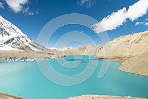 Beautiful view of Tilicho Lake surrounded by mountains in Nepal