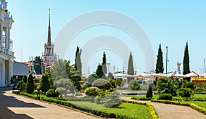 Beautiful view to Commercial seaport and the well-groomed one with topiary evergreens from the Shopping gallery Grand Marina