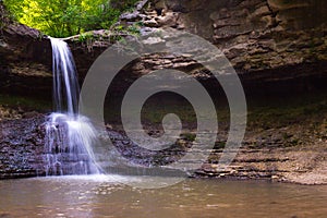 Beautiful view to famous Moldovan waterfall located near the village Saharna, Rezina region, Republic of Moldova seen on