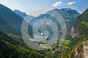 Beautiful view to Geiranger fjord with cruise ship and waterfall, Norway