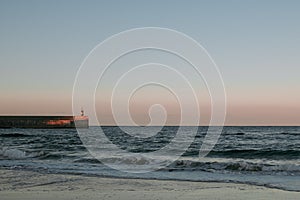 Beautiful view to the lighthouse at sunset, Cantabria, Spain