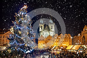 Beautiful view to the old town square of Prague during night time with a Christmas market