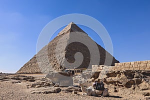 Beautiful View to the One of the Wonders of the Ancient World - Great Pyramids of Giza under Blue Sky and Day Lights of the Sun