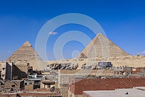 Beautiful View to the One of the Wonders of the Ancient World - Great Pyramids of Giza under Blue Sky and Day Lights of the Sun