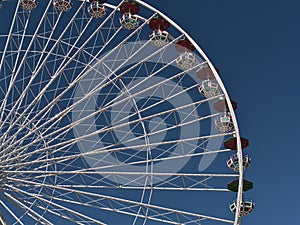 Beautiful view of the top of a giant Ferris wheel in park Wurstelprater in Vienna, Austria.