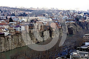 Beautiful view on top of the house on the edge of the cliff of the Kura river in Tbilisi