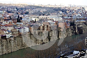 Beautiful view on top of the house on the edge of the cliff of the Kura river in Tbilisi