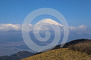 Beautiful view of the top of Mount Fuji covered in snow from Mount Komagatake, Japan