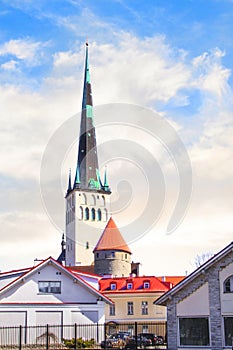 Beautiful view of the tower Oleviste Churchand the Fortress wall in Tallinn, Estonia