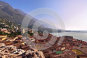 Beautiful view of town Malcesine and the Alps mountains on Lago di Garda, skyline view. Veneto, Italy