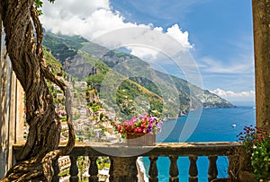 Beautiful view of the town of Positano from antique terrace with flowers