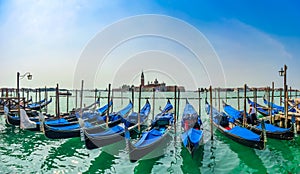 Beautiful view of traditional Gondolas on Canal Grande with San Giorgio Maggiore church at morning, Venice, Italy