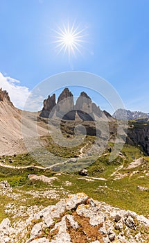 Beautiful view of Tre Cime di Lavaredo under midday sun.