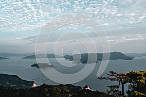 Beautiful view on trees and cloudy sky and pearl farms from Mount Misen at Miyajima island in Hiroshima Japan