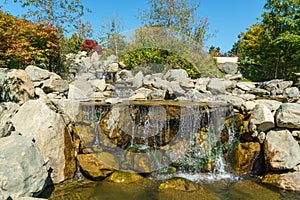 Beautiful view of Triple waterfall in Japanese garden. Public landscape park of Krasnodar or Galitsky Park