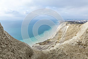 Beautiful view of the turquoise sea from above from the mountains on a sunny day. Rest and relaxation at the resort. Magnificent