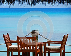 Beautiful view at turquoise sea lagoon with blue sky from tropical Maldives island.