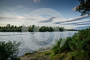 Beautiful view of Ukrainian Desna river, calm waters, dramatic skies